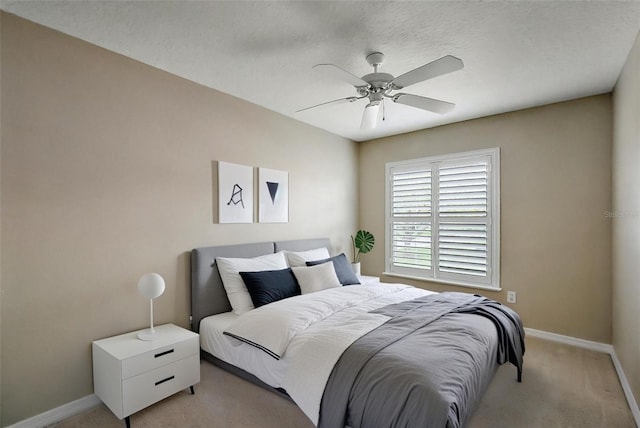 5359 Compass Pt, Oxford, FL 34484 - bedroom featuring ceiling fan, a textured ceiling, baseboards, and light carpet