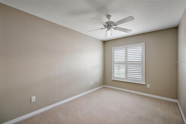 5359 Compass Pt, Oxford, FL 34484 - empty room with light carpet, a textured ceiling, baseboards, and a ceiling fan