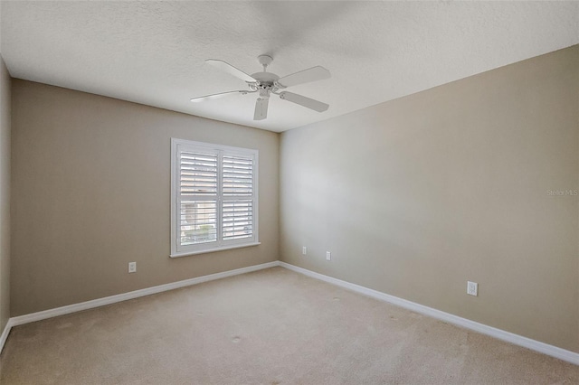 5359 Compass Pt, Oxford, FL 34484 - unfurnished room with light carpet, a textured ceiling, baseboards, and ceiling fan