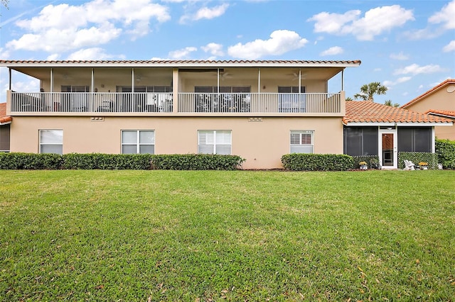5359 Compass Pt, Oxford, FL 34484 - back of property featuring a tile roof, stucco siding, and a lawn