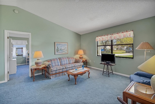 living room with baseboards, carpet flooring, a textured ceiling, and lofted ceiling