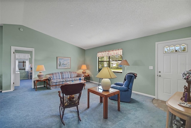 living room featuring lofted ceiling, a textured ceiling, and carpet flooring