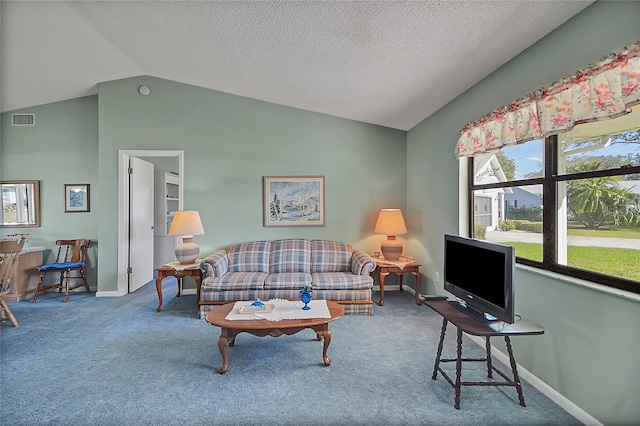 living area with visible vents, carpet flooring, baseboards, and lofted ceiling