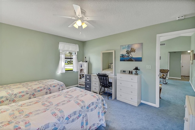 bedroom with baseboards, light carpet, a textured ceiling, and ceiling fan