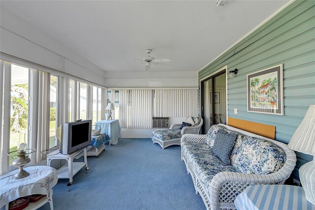 sunroom featuring ceiling fan