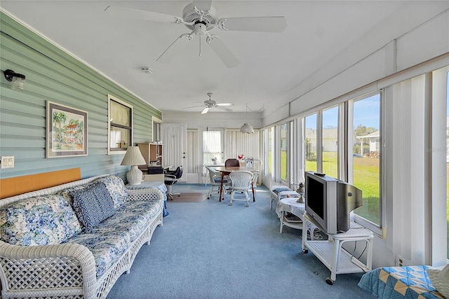 sunroom with a ceiling fan