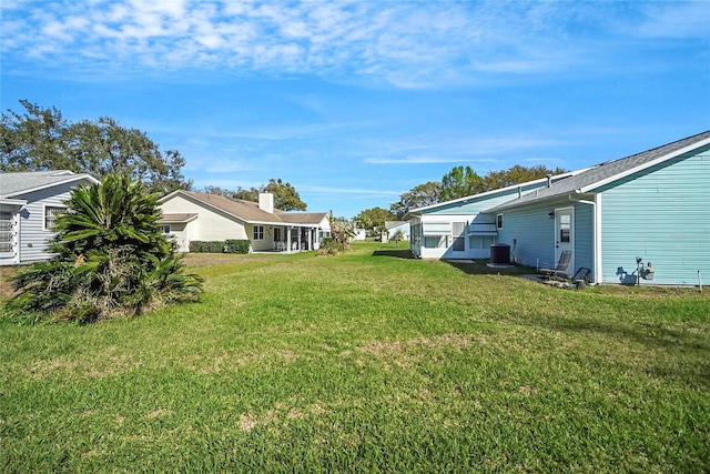 view of yard with central AC