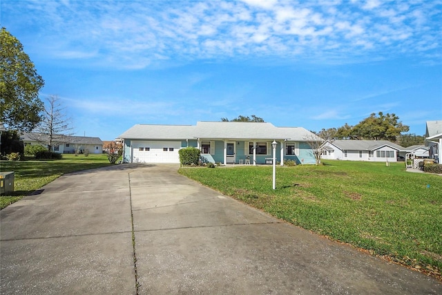 ranch-style house with a garage, driveway, and a front yard