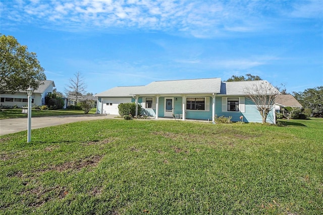 ranch-style house featuring a front yard, an attached garage, and driveway