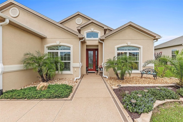 doorway to property with stucco siding