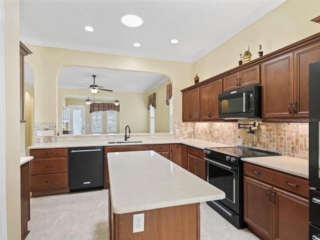 kitchen with backsplash, black appliances, ceiling fan, arched walkways, and a sink