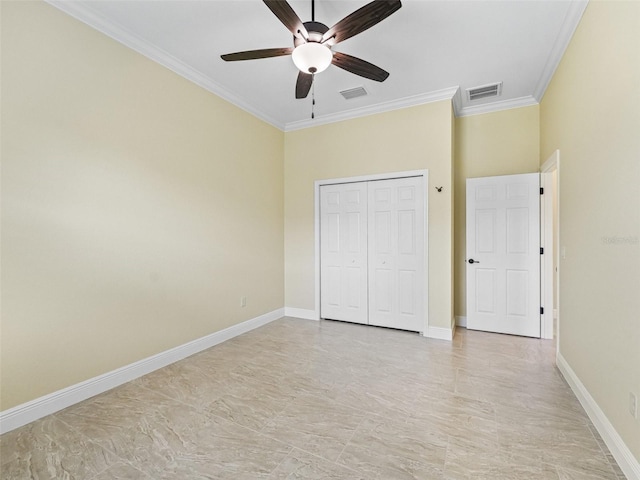 unfurnished bedroom with crown molding, visible vents, baseboards, and a closet
