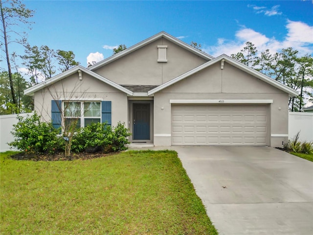 ranch-style home with stucco siding, a front lawn, driveway, fence, and a garage