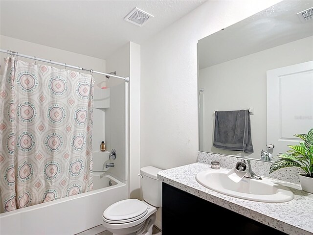 full bathroom with vanity, shower / bath combination with curtain, toilet, and visible vents