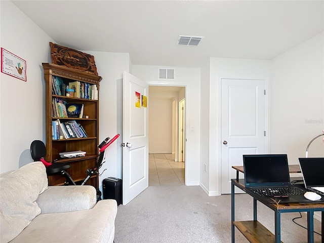 office featuring visible vents and light carpet