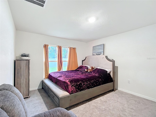 bedroom featuring visible vents, baseboards, and carpet flooring