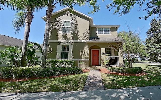 view of front of home with stucco siding and a porch