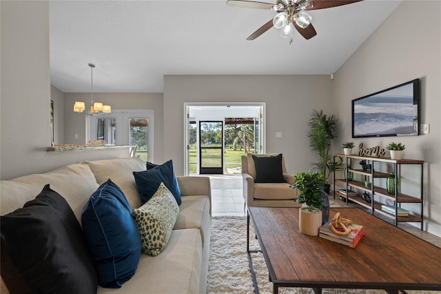 living area featuring carpet floors and ceiling fan with notable chandelier