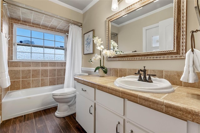 bathroom with vanity, wood finish floors, shower / bath combo, crown molding, and toilet