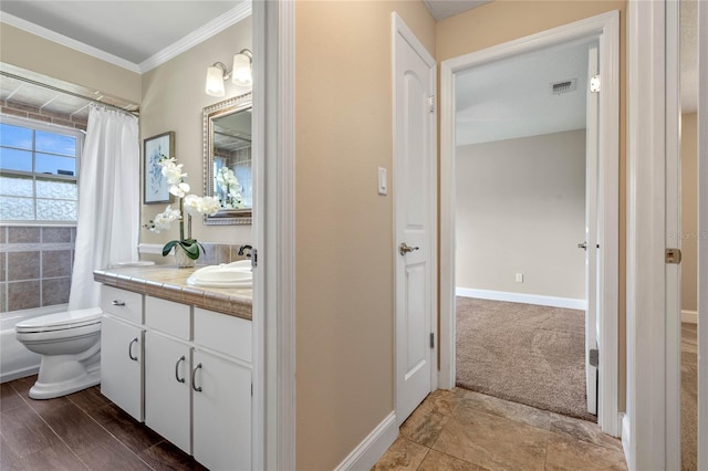 bathroom with visible vents, toilet, ornamental molding, baseboards, and vanity