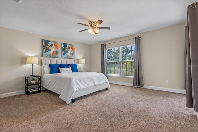 bedroom featuring baseboards, carpet floors, and ceiling fan