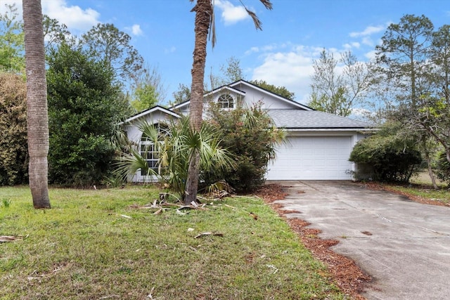 view of front of home featuring a garage, concrete driveway, a front lawn, and a shingled roof