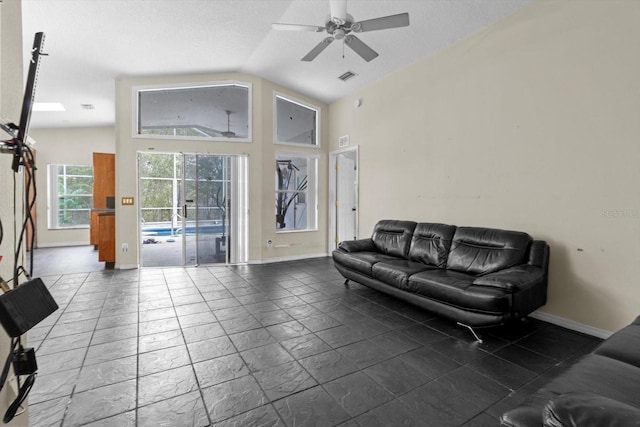 living room featuring ceiling fan, baseboards, visible vents, and high vaulted ceiling