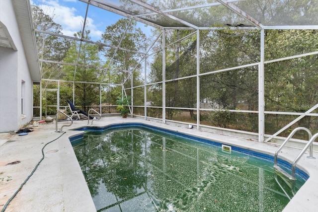 outdoor pool featuring a patio and a lanai