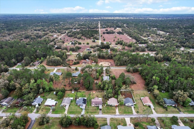 drone / aerial view with a view of trees