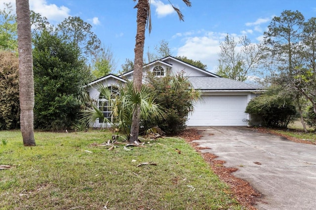 21311 SW Marine Blvd, Dunnellon, FL 34431 - obstructed view of property with driveway, a garage, a front yard, and roof with shingles