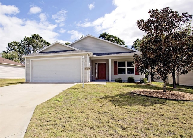 ranch-style house featuring a garage, driveway, and a front lawn