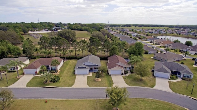 birds eye view of property with a residential view and a water view