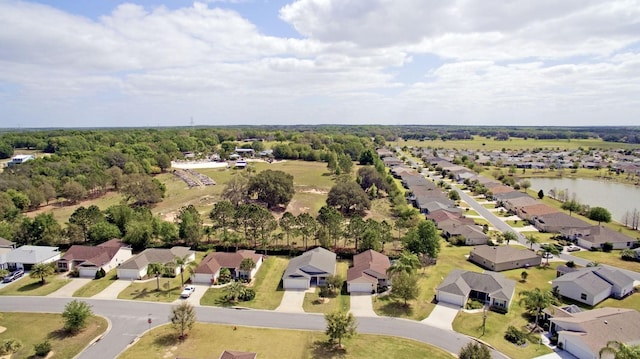 birds eye view of property with a residential view and a water view