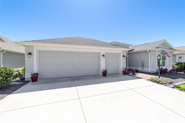 6083 Delphina Loop, The Villages, FL 32163 - ranch-style house featuring stucco siding, an attached garage, driveway, and a shingled roof