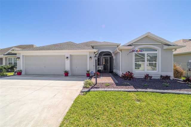 6083 Delphina Loop, The Villages, FL 32163 - ranch-style home with stucco siding, driveway, a front lawn, and a garage