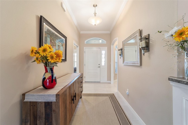 6083 Delphina Loop, The Villages, FL 32163 - doorway with arched walkways, light tile patterned floors, crown molding, and baseboards