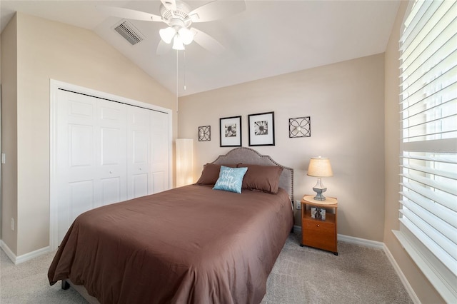 6083 Delphina Loop, The Villages, FL 32163 - carpeted bedroom with visible vents, baseboards, a closet, and vaulted ceiling