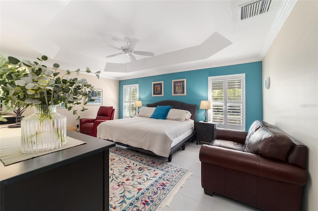 6083 Delphina Loop, The Villages, FL 32163 - bedroom with visible vents, ornamental molding, light tile patterned floors, a raised ceiling, and ceiling fan
