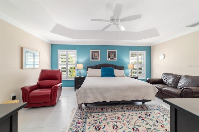 6083 Delphina Loop, The Villages, FL 32163 - bedroom with visible vents, multiple windows, a tray ceiling, and ornamental molding