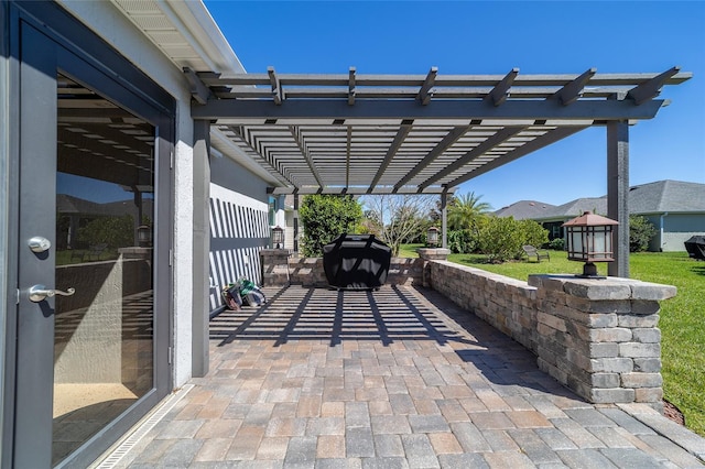 6083 Delphina Loop, The Villages, FL 32163 - view of patio featuring area for grilling, driveway, and a pergola