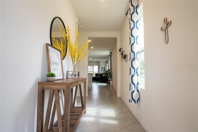 hallway featuring baseboards