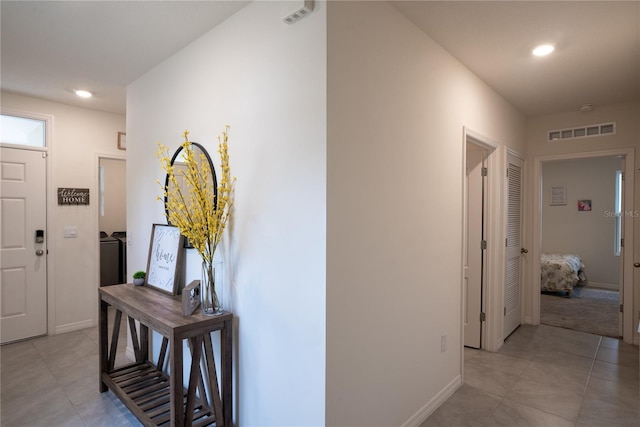 hallway with recessed lighting, baseboards, and visible vents