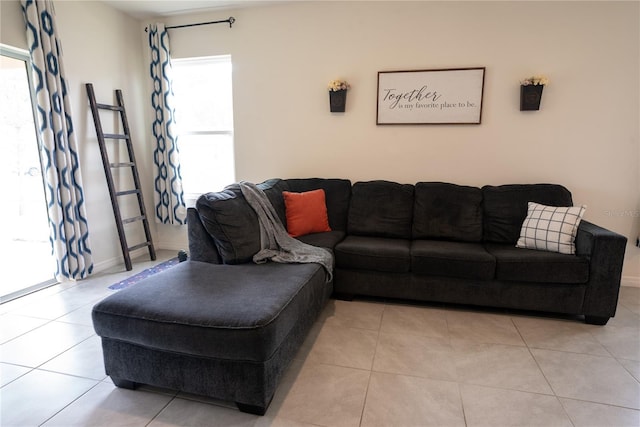 living room featuring tile patterned flooring and baseboards