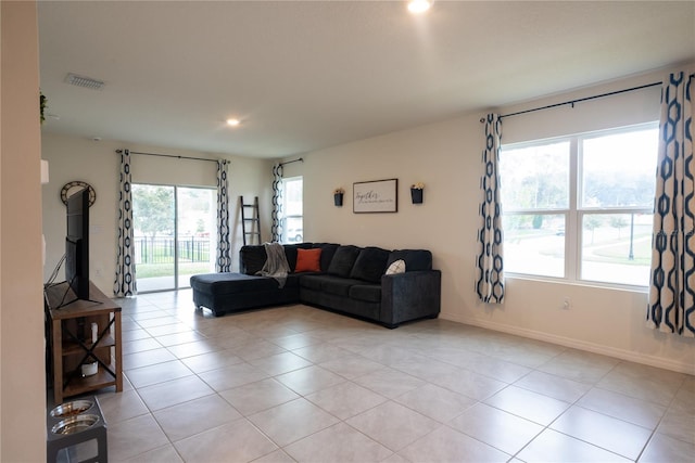 living room with recessed lighting, light tile patterned floors, baseboards, and visible vents