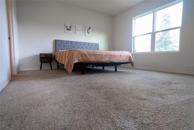 carpeted bedroom with baseboards