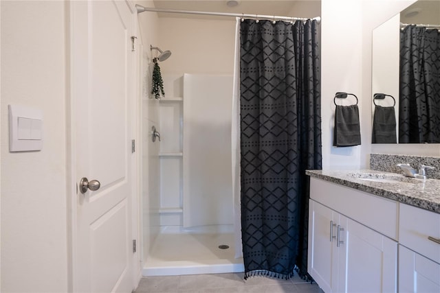 bathroom with vanity, tile patterned floors, and a shower with curtain