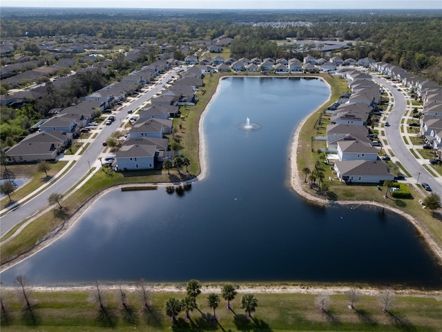 drone / aerial view with a residential view and a water view