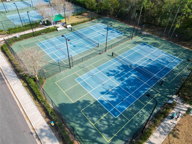 view of tennis court with fence