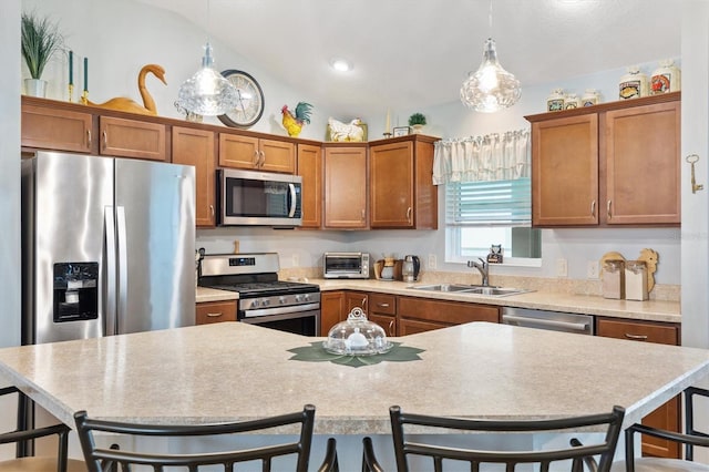 2188 Gordon Path, The Villages, FL 32163 - kitchen featuring brown cabinetry, lofted ceiling, a sink, stainless steel appliances, and a kitchen bar