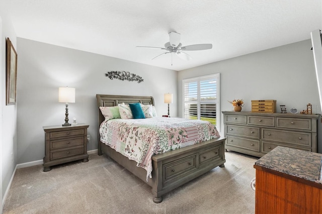 2188 Gordon Path, The Villages, FL 32163 - bedroom featuring baseboards, light carpet, and ceiling fan